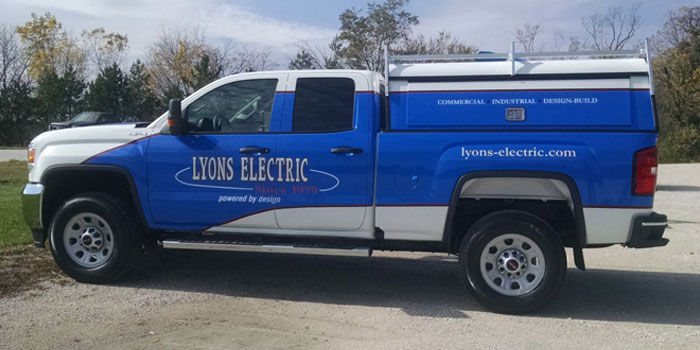 Partial wrap on a GMC Sierra with a cap for Lyons Electric