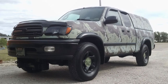 Full camo wrap on a pickup for Masterbilt Fence